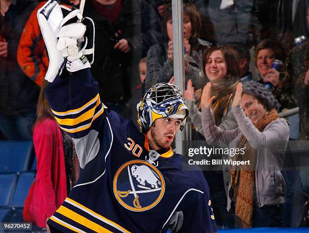 Ryan Miller of the Buffalo Sabres joins fans in celebrating their 2-1 victory over the Boston Bruins on January 29, 2010 at HSBC Arena in Buffalo,...