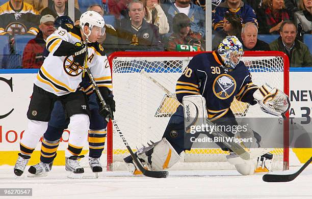 Ryan Miller of the Buffalo Sabres makes a glove save in front of Mark Recchi of the Boston Bruins on January 29, 2010 at HSBC Arena in Buffalo, New...