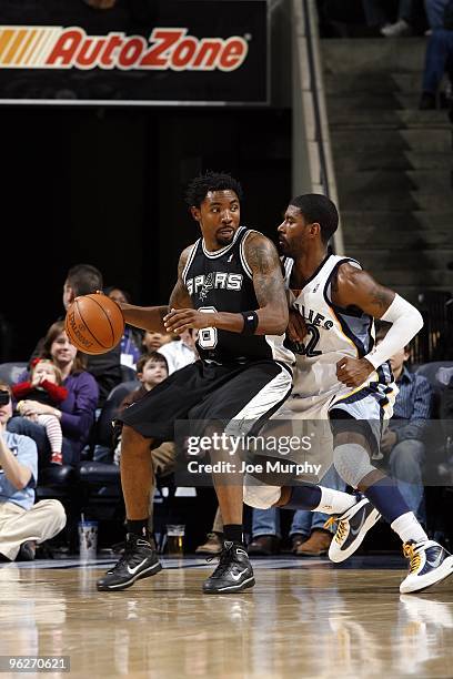 Roger Mason Jr. #8 of the San Antonio Spurs posts up against O.J. Mayo of the Memphis Grizzlies during the game at the FedExForum on January 16, 2010...