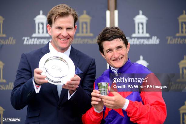 Trainer Ken Condon and jockey Shane Foley pose with the trophy after Romanised won the Tattersalls Irish 2000 Guineas during day one of the 2018...