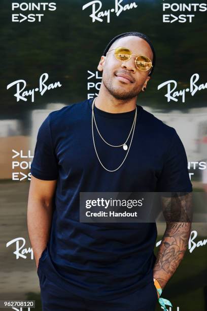 In this handout image supplied by Ray-Ban, Reggie Yates wearing Ray-Ban poses at the Ray-Ban Studios during All Points East Festival at Victoria Park...