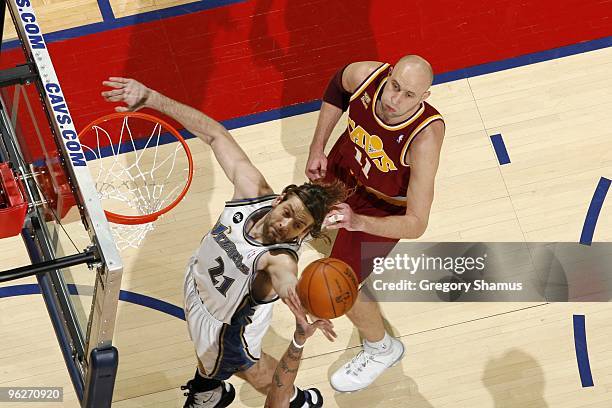 Fabricio Oberto of the Washington Wizards rebounds against Zydrunas Ilgauskas of the Cleveland Cavaliers during the game at Quicken Loans Arena on...