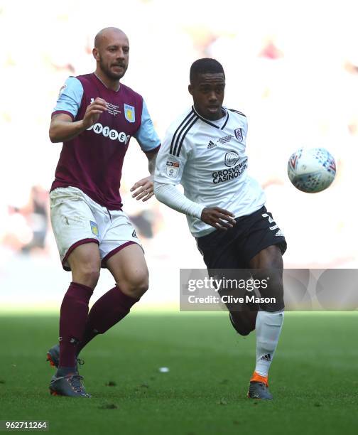 Alan Hutton of Aston Villa battles for possession with Ryan Sessegnon of Fulham during the Sky Bet Championship Play Off Final between Aston Villa...