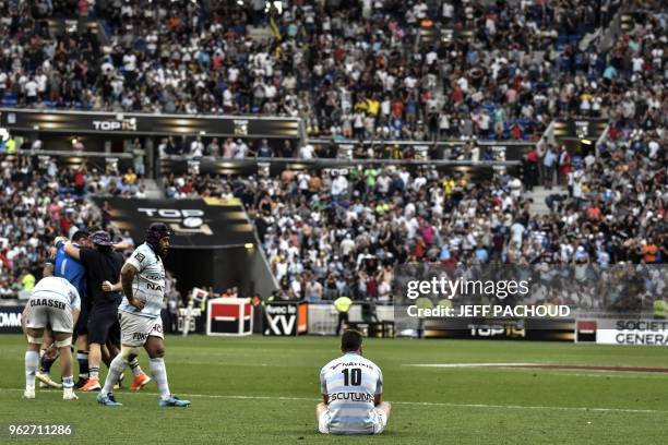 Racing 92's French fly-half Remi Tales reacts after his team lost the French Top 14 rugby union semi-final match between Racing 92 and Castres...