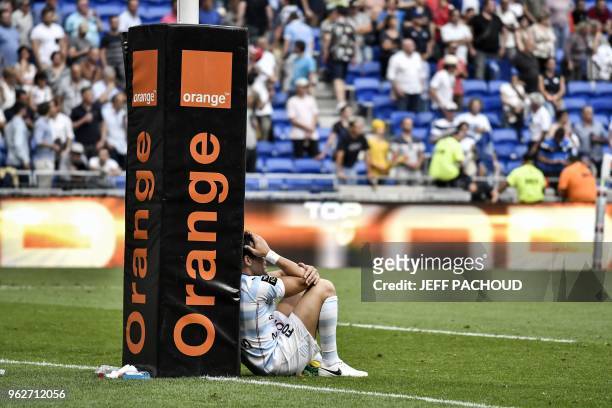 Racing 92's French fly-half Benjamin Dambielle reacts after his team lost the French Top 14 rugby union semi-final match between Racing 92 and...