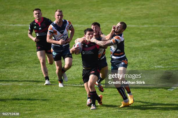 James Saltonstall of Halifax and Joshua Hardcastle of Featherstone in action during the Rugby League 2018 Summer Bash match between Halifax and...