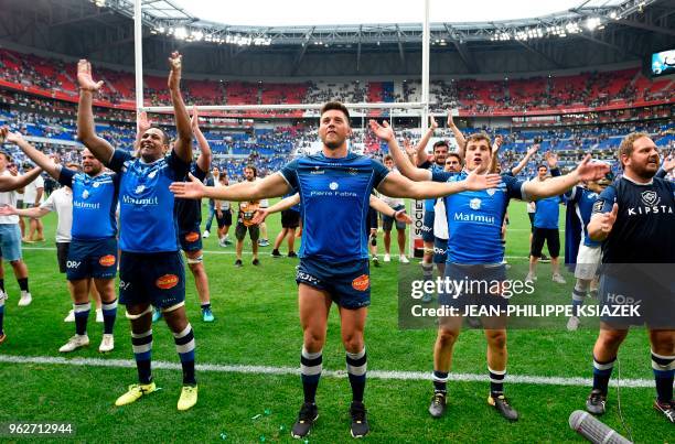 Castres' players celebrate after winning the French Top 14 rugby union semi-final match between Racing 92 and Castres Olympique on May 26, 2018 at...