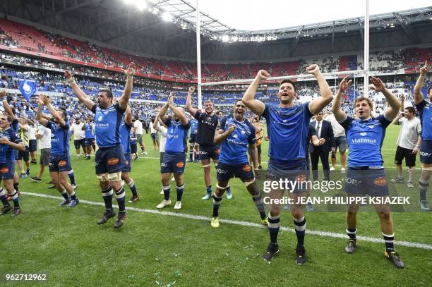 Castres' players celebrate after winning the French Top 14 rugby union semi-final match between Racing 92 and Castres Olympique on May 26, 2018 at...