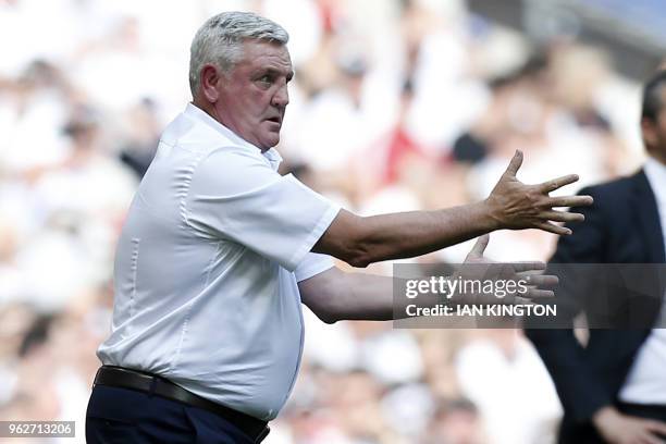 Aston Villa's English manager Steve Bruce gestures on the touchline during the English Championship play-off final football match between Aston Villa...