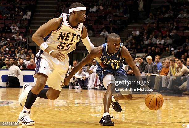 Earl Boykins of the Washington Wizards controls the ball against Keyon Dooling of the New Jersey Nets at the Izod Center on January 29, 2010 in East...