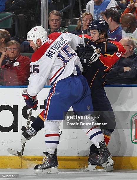 Michael Frolik of the Florida Panthers is hit by Glen Metropolit of the Montreal Canadiens at the BankAtlantic Center on January 26, 2010 in Sunrise,...