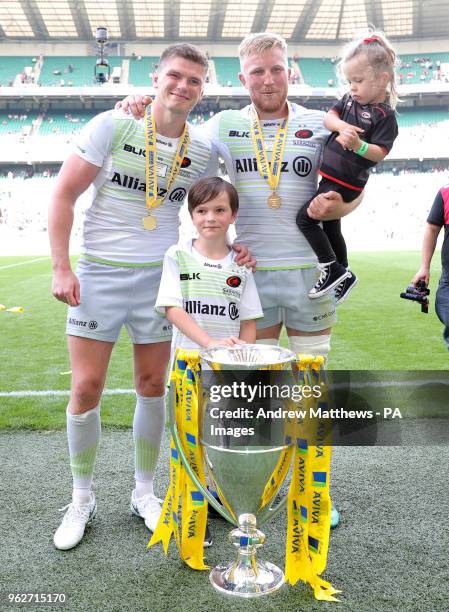 Saracens' Owen Farrell and Jackson Wray celebrates with the trophy after his side win the Aviva Premiership Final at Twickenham Stadium, London.
