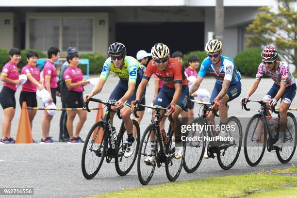 Chris Harper , Meiyin Wang and Grega Bole , and Yuzuru Suzuki , in action watched by female students from Keirin School, during Izu stage, 120.8km on...