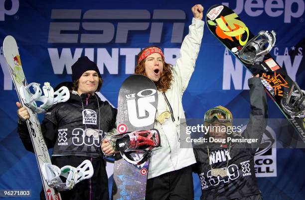 Shaun White of the USA takes the podium after winning the gold medal in the Men's Snowboard Superpipe along with Iouri Podladtchikov of Switzerland...