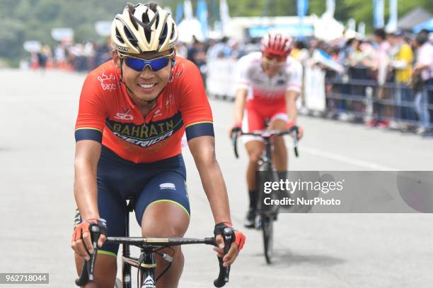 Chinese rider Meiyin Wang from Bahrain - Merida Team at the finish line of Izu stage, 120.8km on Izu-Japan Cycle Sports Center Road Circuit, the...