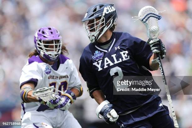 Troy Reh of Albany defends Ben Reeves of Yale during the 2018 NCAA Division I Men's Lacrosse Championship Semifinals at Gillette Stadium on May 26,...