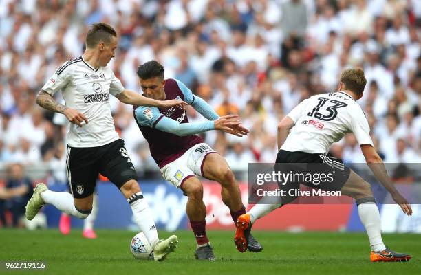 Jack Grealish of Aston Villa turns on the ball past Stefan Johansen of Fulham during the Sky Bet Championship Play Off Final between Aston Villa and...