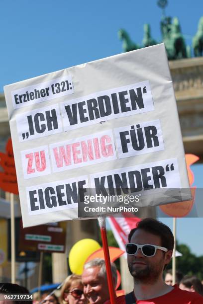 Demonstrants hold a banner that reads ' KInder Brauchen Eine Zukunft - Kids Need A future' during a gathering to protest agains the recent Kita...