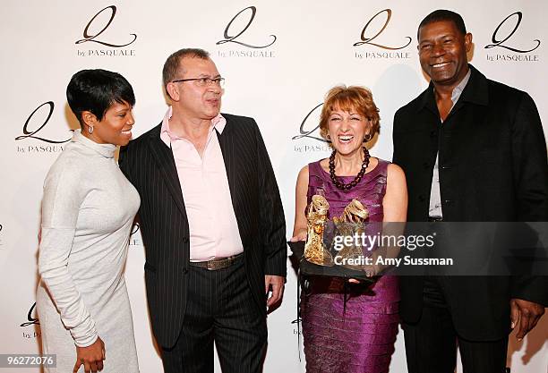 Actress Regina King, designer Pasquale Fabrizio, Lina Fabrizio and actor Dennis Haysbert attend the debut of "Q by Pascale" glass shoes on January...