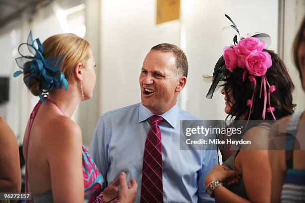 Prime Minister of New Zealand John Key talks with race goers during the Wellington Cup Day meeting at Trentham Racecourse on January 30, 2010 in...