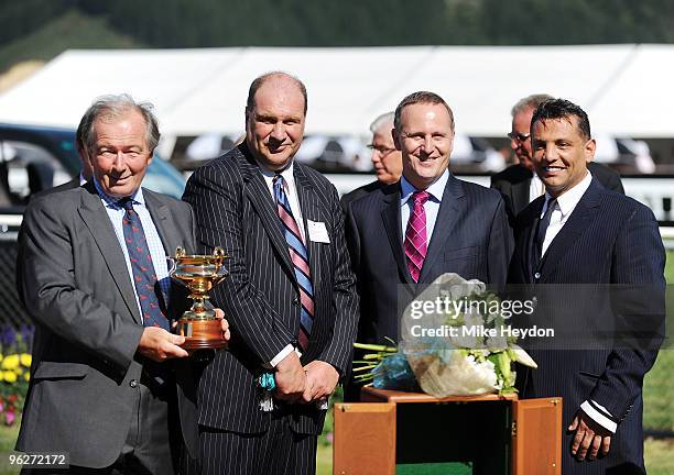 Owner of Wellington Cup winner Red Ruler G B Sargent holding the Wellington Cup with Andrew Meehan, John Key and Terry Serepisos after the Century...