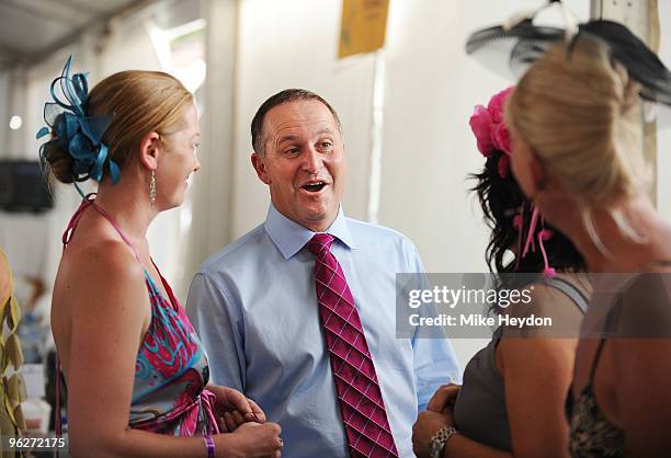 Prime Minister of New Zealand John Key talks with race goers during the Wellington Cup Day meeting at Trentham Racecourse on January 30, 2010 in...