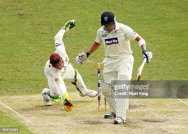 Wicketkeeper Chris Hartley of the Bulls lunges to attempt a catch off Peter Forrest of the Blues during day two of the Sheffield Shield match between...