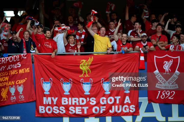 Liverpool fans cheer behind their banners before kick off of the UEFA Champions League final football match between Liverpool and Real Madrid at the...