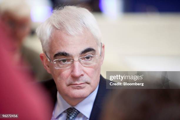 Alistair Darling, U.K., chancellor of the exchequer, listens during an interview between sessions on day three of the 2010 World Economic Forum...