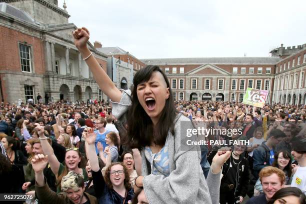 Yes' campaigners celebrate the official result of the Irish abortion referendum at Dublin Castle in Dublin on May 26, 2018 which showed a landslide...