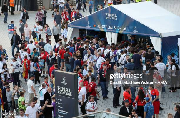 Supporters queue up to buy Champions League merchandise at an official shop prior to the UEFA Champions League final between Real Madrid and...