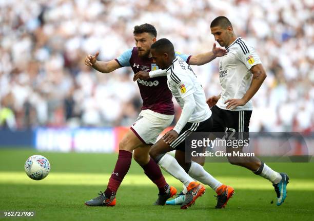 Ryan Sessegnon and Aleksandar Mitrovic of Fulham put pressure on Robert Snodgrass of Aston Villa during the Sky Bet Championship Play Off Final...
