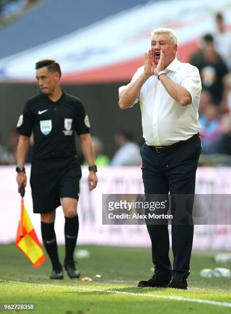 Steve Bruce, Manager of Aston Villa gives his team instructions during the Sky Bet Championship Play Off Final between Aston Villa and Fulham at...