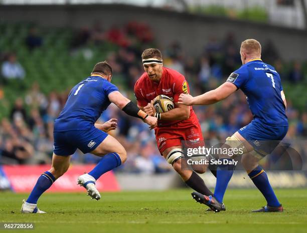 Dublin , Ireland - 26 May 2018; Steve Cummins of Scarlets is tackled by Cian Healy, left, and Dan Leavy of Leinster during the Guinness PRO14 Final...