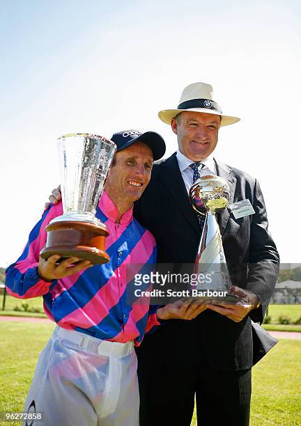 Jockey Damien Oliver poses with trainer David Hayes after riding Nicconi to win the Coolmore Lightning Stakes during the Coolmore Lightning Stakes...