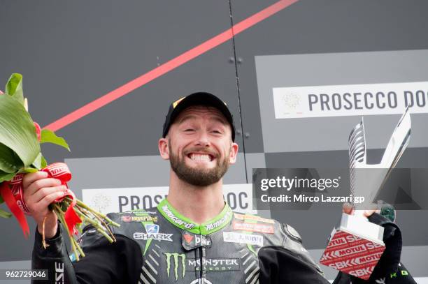 Tom Sykes of Great Britain and KAWASAKI RACING TEAM WorldSBK celebrates the third place on the podium at the end of the Superbike Race 1 during the...