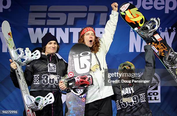 Shaun White of the USA takes the podium after winning the gold medal in the Men's Snowboard Superpipe along with Iouri Podladtchikov of Switzerland...