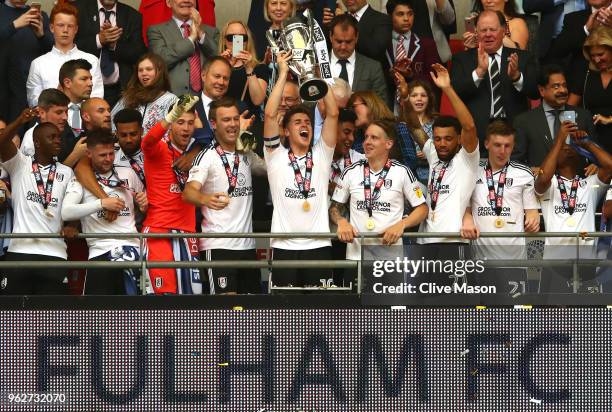 Tom Cairney of Fulham lifts the trophy following his sides victory in the Sky Bet Championship Play Off Final between Aston Villa and Fulham at...