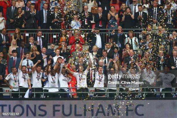 Tom Cairney of Fulham and Kevin McDonald of Fulham lift the trophy following their sides victory in the Sky Bet Championship Play Off Final between...