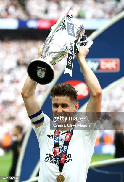 Tom Cairney of Fulham celebrates with the trophy following his sides victory in the Sky Bet Championship Play Off Final between Aston Villa and...