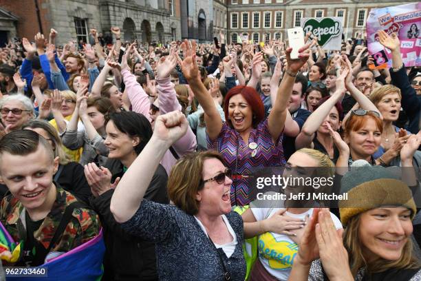 Supporters celebrate at Dublin Castle following the result Irish referendum result on the 8th amendment, concerning the country's abortion laws, on...