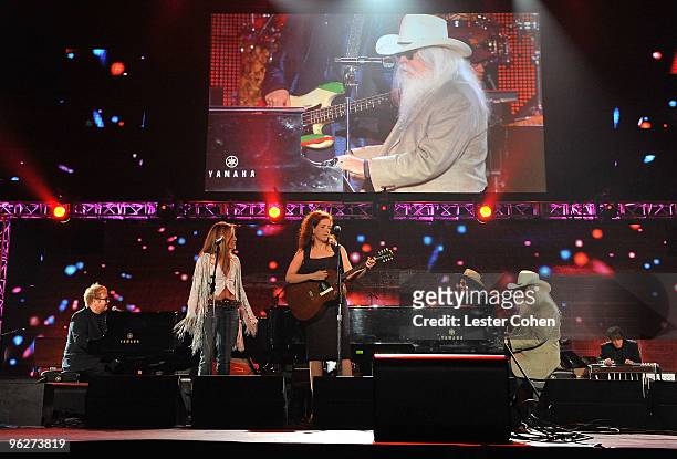 Musicians Sir Elton John, Sheryl Crow, Neko Case and Leon Russell perform onstage at the 2010 MusiCares Person Of The Year Tribute To Neil Young at...