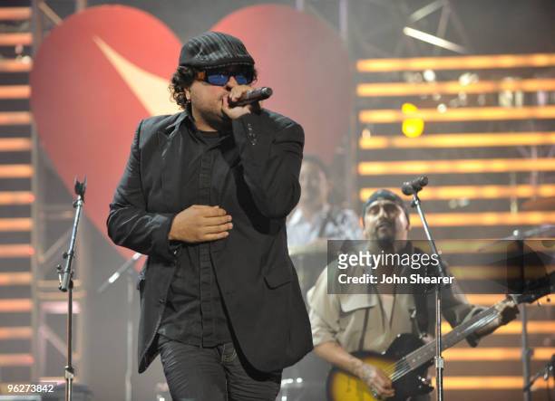 Musicians Asdru and Raul of the band Ozomatli perform at the 2010 MusiCares Person Of The Year Tribute To Neil Young at the Los Angeles Convention...
