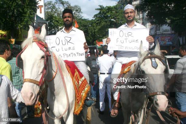 Congress workers ride horse and part in the protest rally against Central Government,Price hike Petrol and Diesel on May 26,2018 in Kolkata,India.