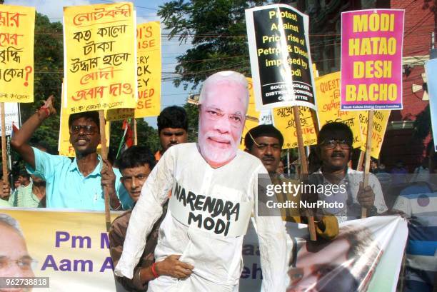 Congress supporters hold on Indian prime Minister Narandra Modi Effigy at the Indian Political party Congress protest price hike Petrol and Diesel on...