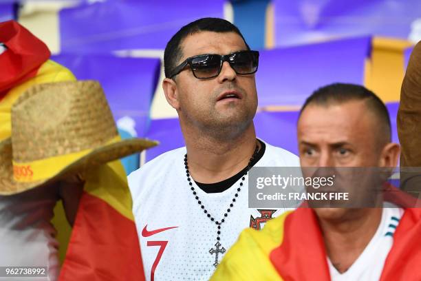 Hugo Aveiro, the brother of Real Madrid's Portuguese forward Cristiano Ronaldo, look on prior to the UEFA Champions League final football match...