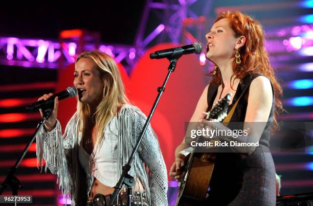 Musicians Sheryl Crow and Neko Case perform at the 2010 MusiCares Person Of The Year Tribute To Neil Young at the Los Angeles Convention Center on...