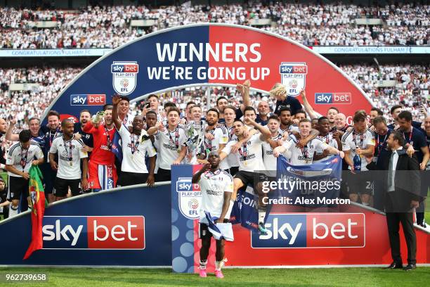 Fulham players celebrate with the trophy following their sides victory in the Sky Bet Championship Play Off Final between Aston Villa and Fulham at...