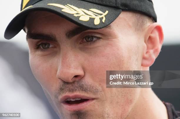 Loris Baz of France and Gulf Althea BMW Racing Team speask with journalist and celebrates the third place at the end of the Super Pole during the...