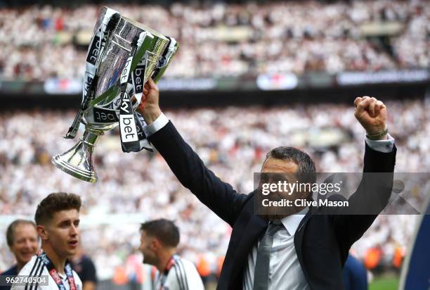 Slavisa Jokanovic, Manager of Fulham celebrates with the trophy following his sides victory in the Sky Bet Championship Play Off Final between Aston...